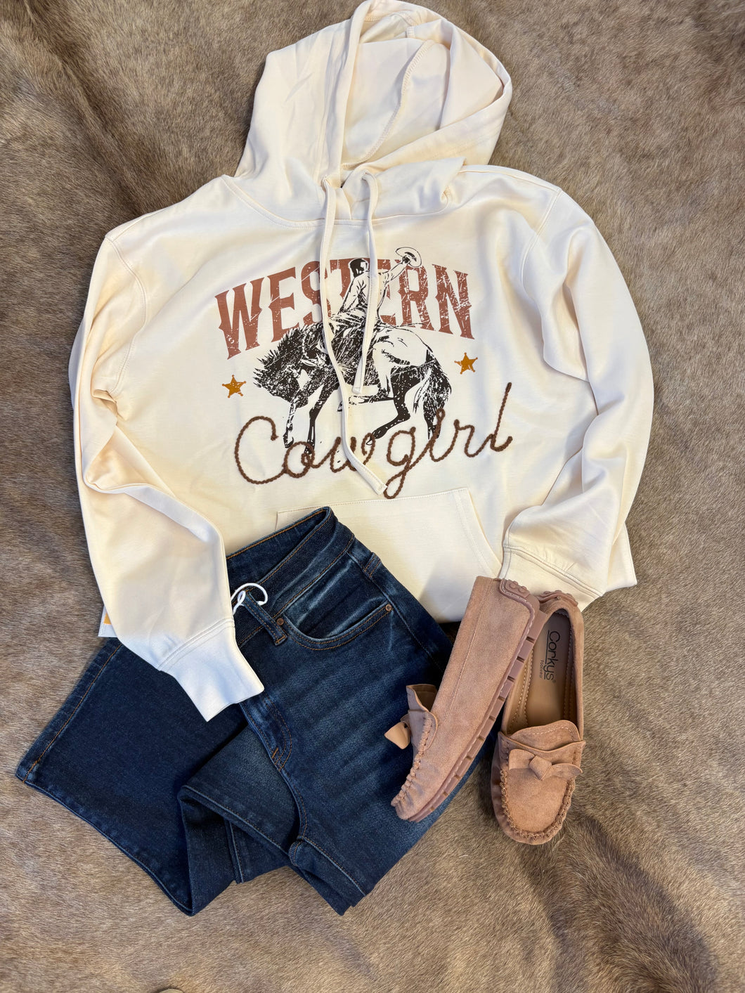Unlined butter-soft hoodie with embroidered cowgirl detail and “Western Cowgirl” print, styled with Driving Miss Daisy Mocs.