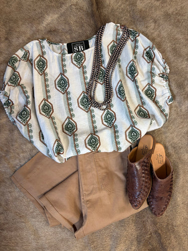 Slightly oversized geometric print shirt with dolman sleeves, available in navy and green, styled with Harvest Crop Jean.