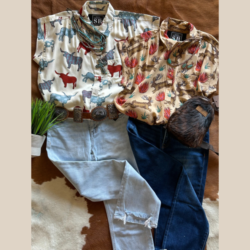 Neutral short-sleeve button-up with red, blue, and purple longhorn print and classic collar.