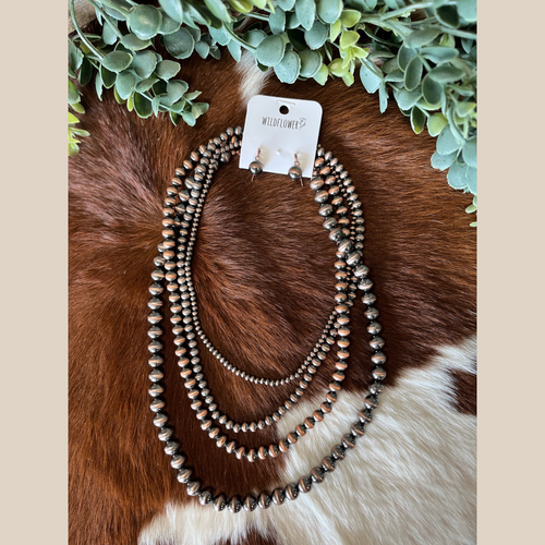 Casual copper layered pearl necklace with small copper ball dangle earrings.