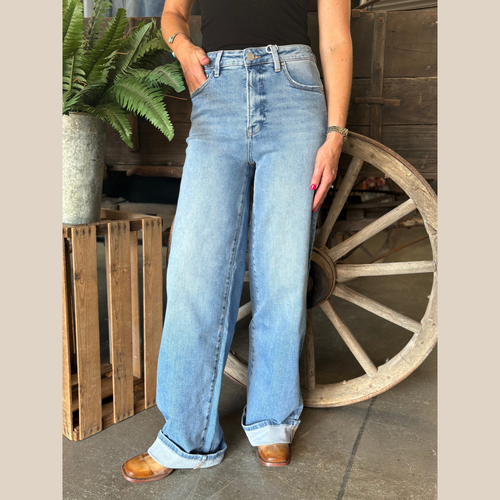 Wide leg high rise jeans from Risen in a medium wash featuring a flattering high waist, relaxed wide leg silhouette and minimal detailing for a clean, modern look. 