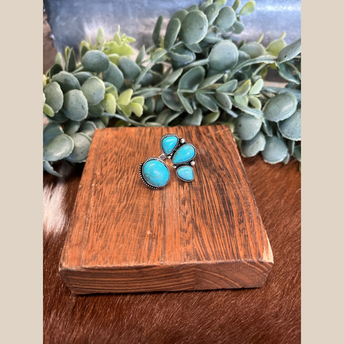 Western turquoise stone cuff ring with adjustable band.