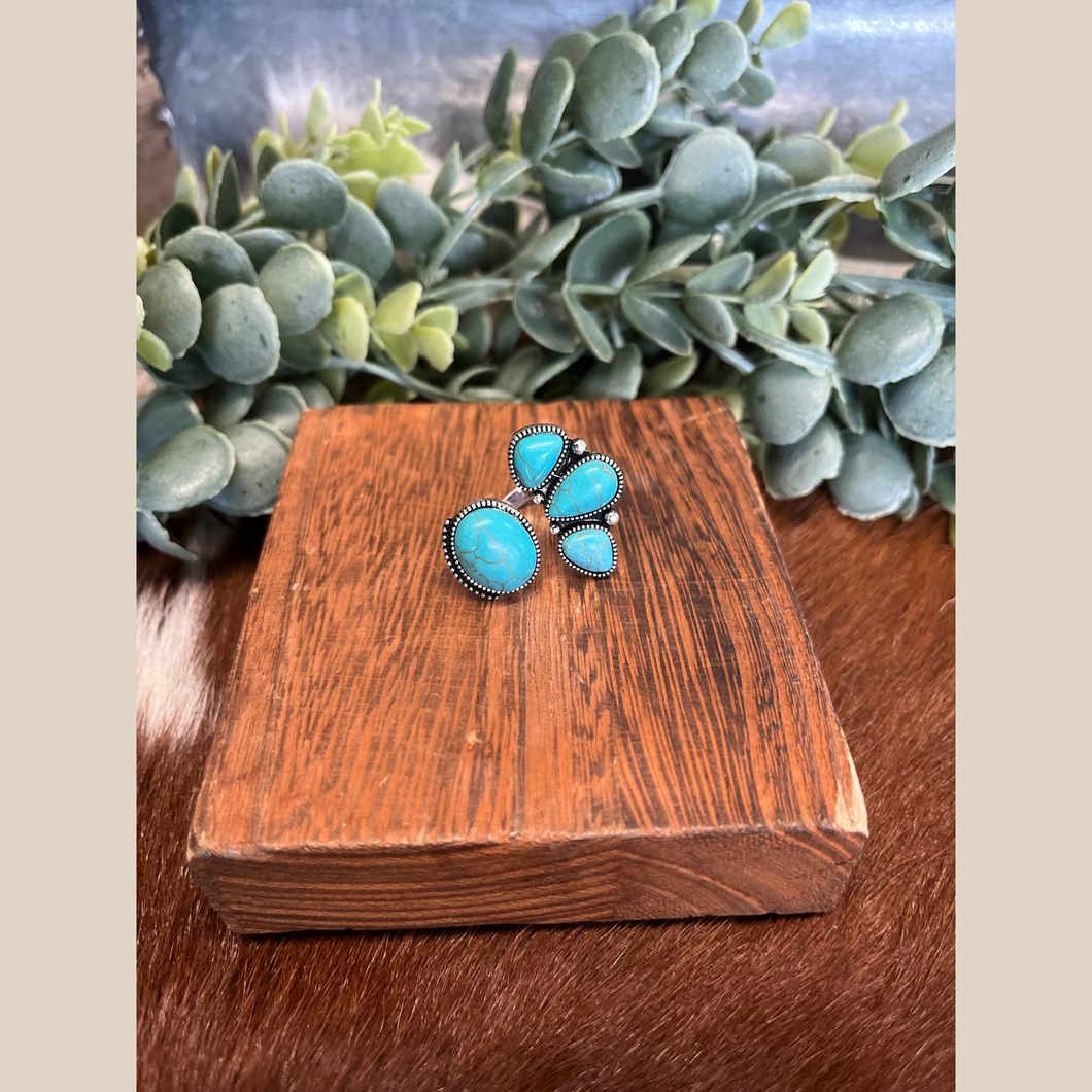 Western turquoise stone cuff ring with adjustable band.